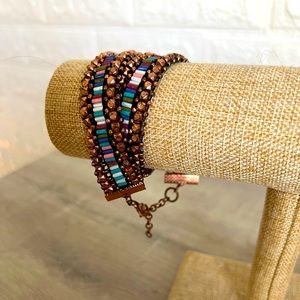 Multi colored double wrap bracelet with rose child beads.